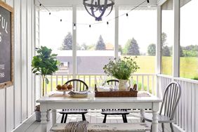 Porch with table and string lights