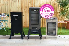 A variety of electric smokers in an outdoor setting