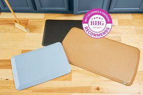 Three of the best anti-fatigue kitchen mats piled on a wood floor with a BHG Recommends badge.