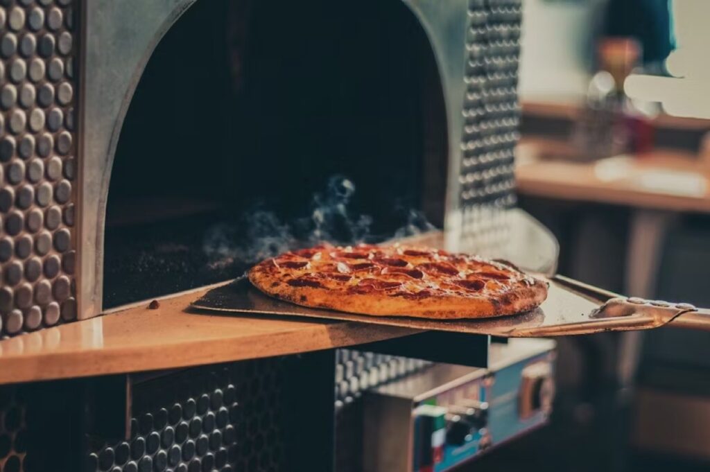 DaddyO's Pizza background of pizza coming out of an oven